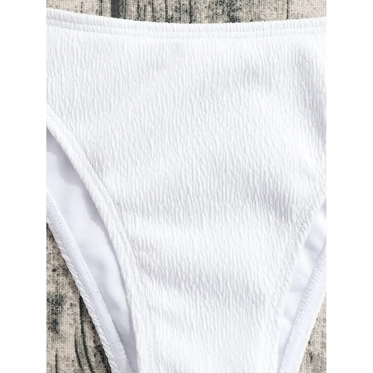 White eco-friendly bikini in textured fabric with wooden rings